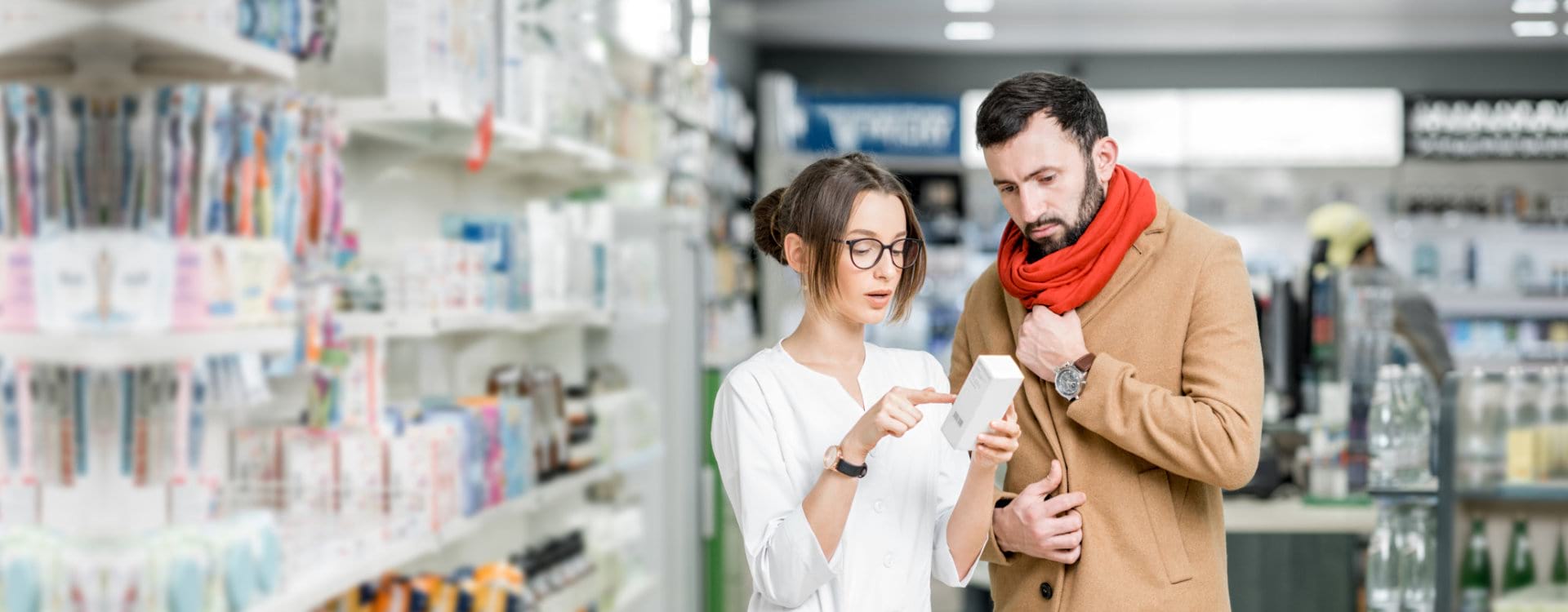 customer and pharmacist looking at the medicine